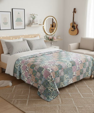 Reversible floral patchwork queen-size cotton quilt.