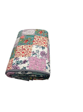Reversible floral patchwork queen-size cotton quilt.