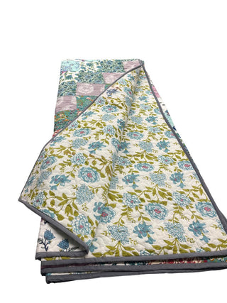 Reversible floral patchwork queen-size cotton quilt.