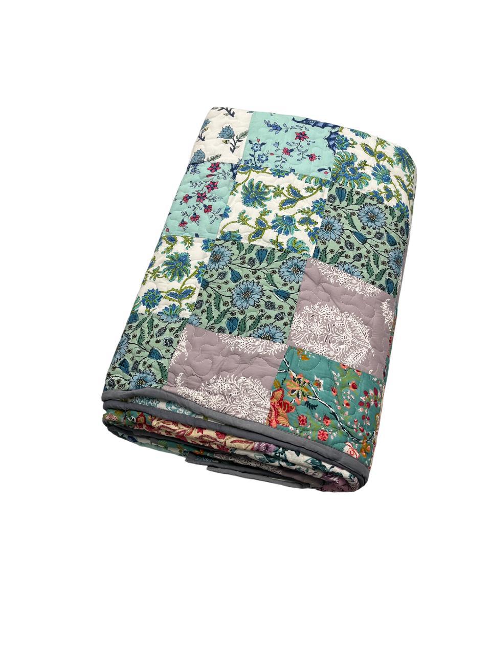 Reversible floral patchwork queen-size cotton quilt.